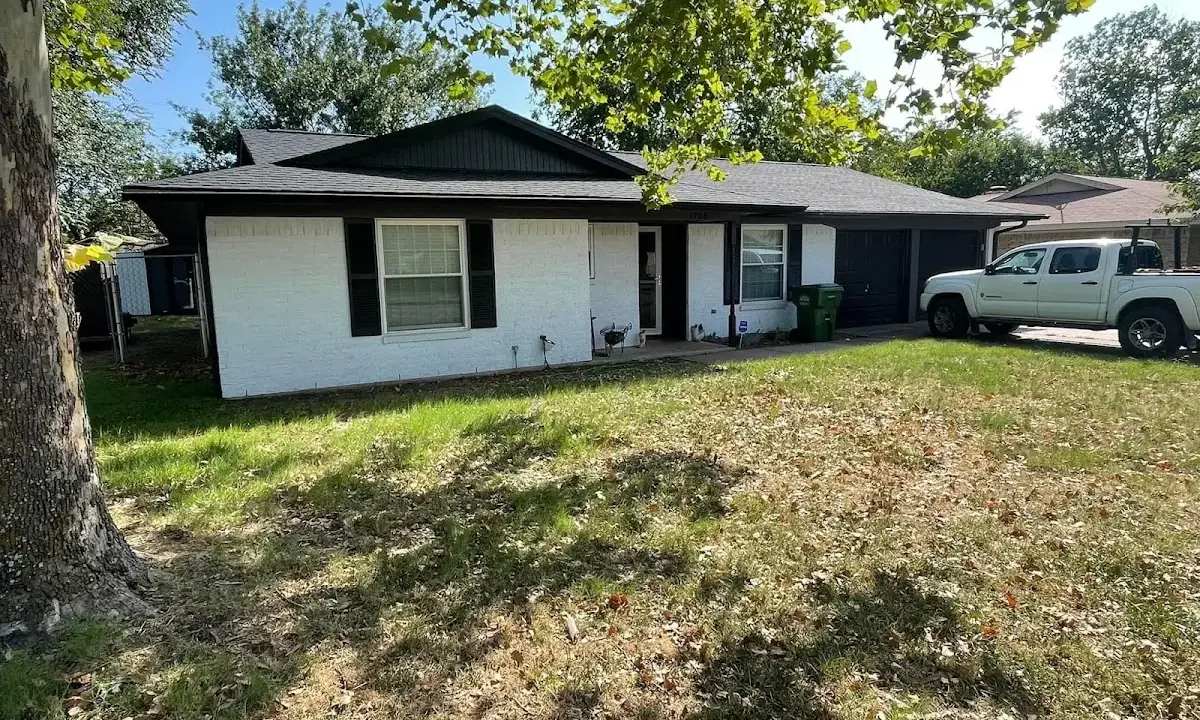 Professional roofing crew working on a residential roof in Braintree Town